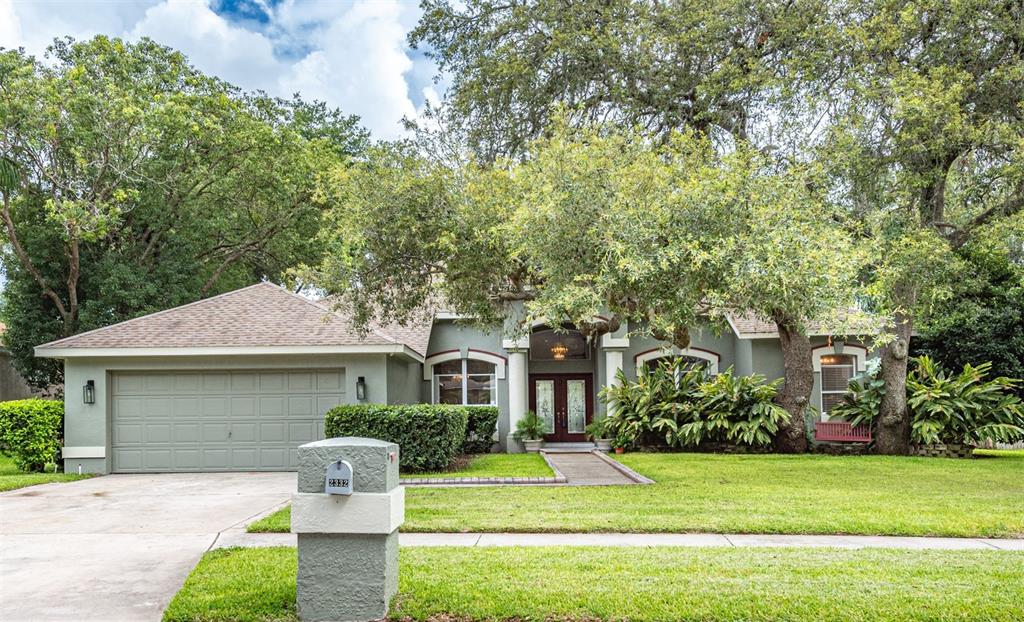 2332 Timbergrove Drive Valrico, FL 33596 - Photo 1 of 1 a front view of a house with a yard and garage