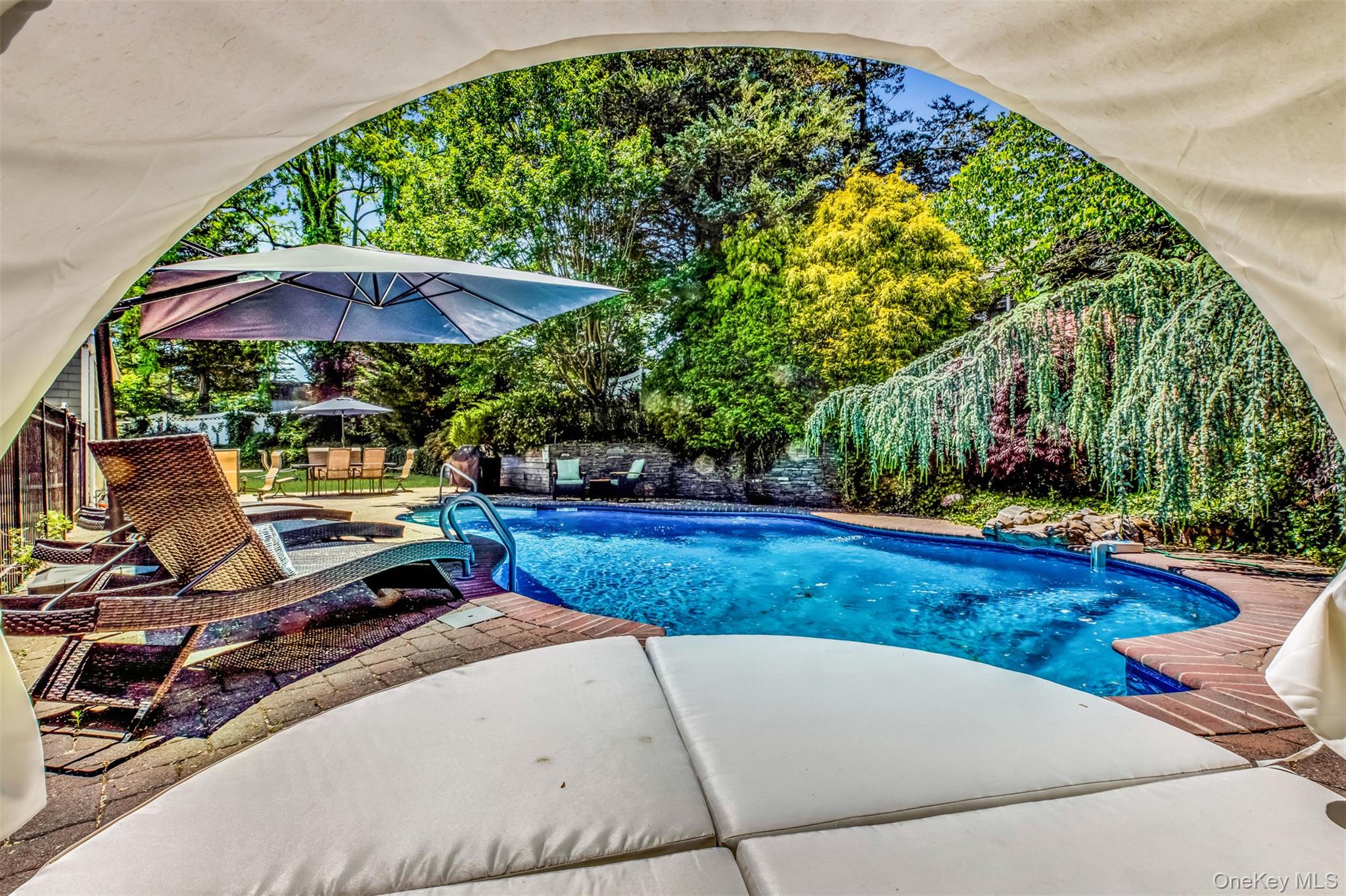 345 Colonial Road Southold, NY 11971 - Photo 34 of 43 a view of a backyard with potted plants