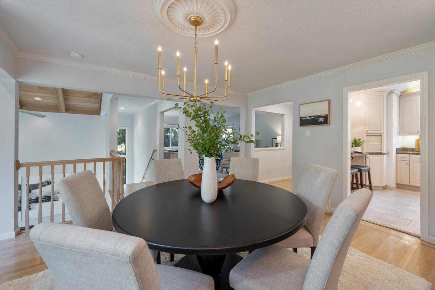 37 Vía Canon Millbrae, CA 94030 - Photo 21 of 69 a dining room with wooden floor a chandelier a wooden table and chairs