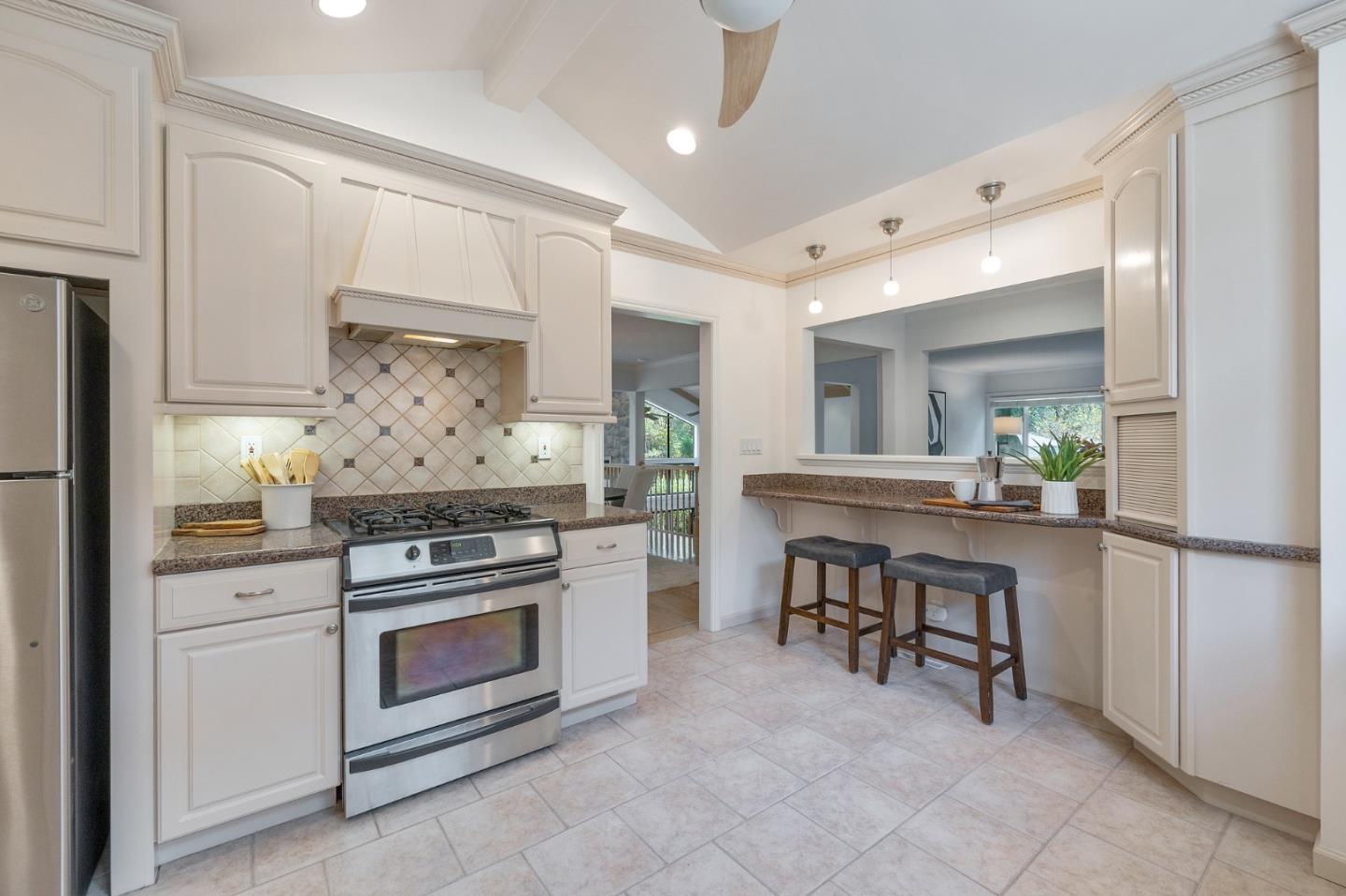 37 Vía Canon Millbrae, CA 94030 - Photo 32 of 69 a kitchen with white cabinets and appliances