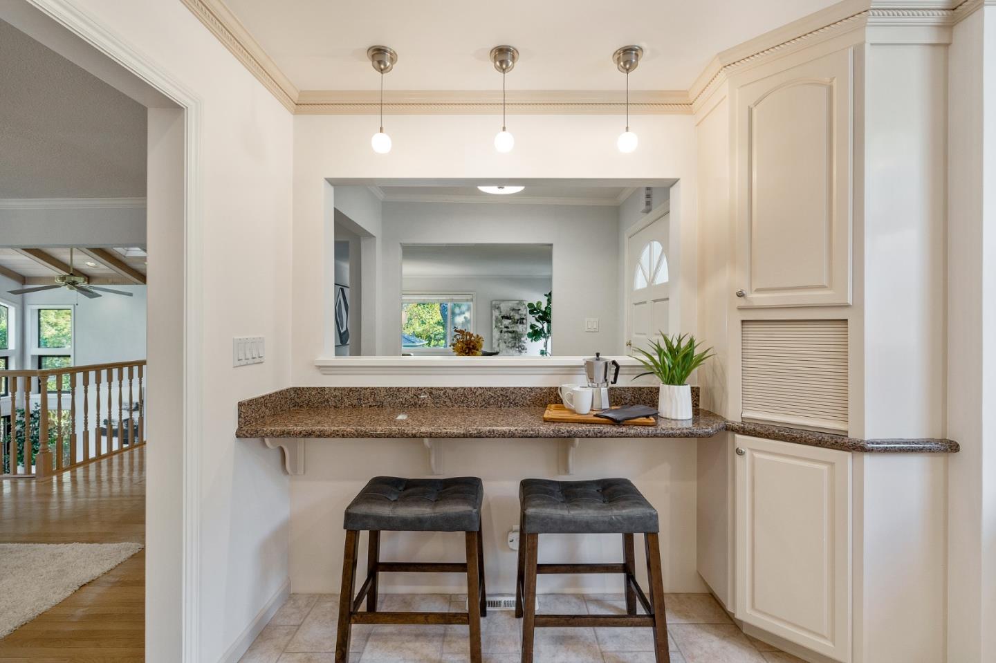 37 Vía Canon Millbrae, CA 94030 - Photo 33 of 69 a kitchen with kitchen island a dining table chairs cabinets and stainless steel appliances