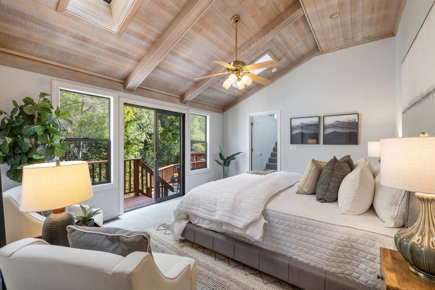 37 Vía Canon Millbrae, CA 94030 - Photo 36 of 69 a bedroom with a bed a ceiling fan and a large window with the potted plants