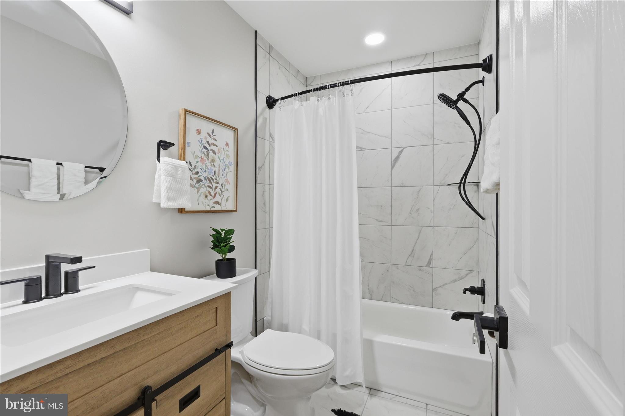 8855 Lowell Road Pomfret, MD 20675 - Photo 22 of 48 Main level hall bathroom