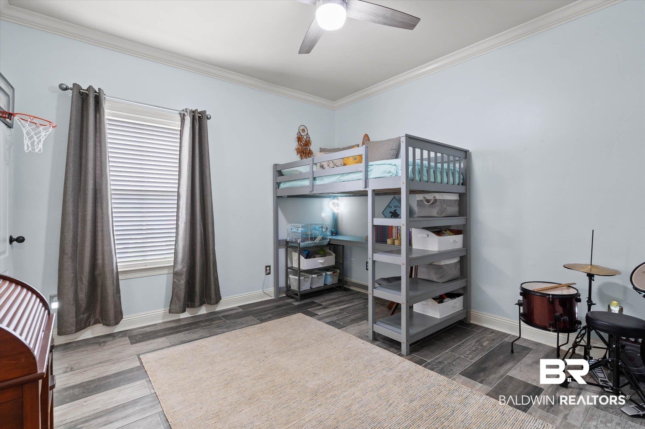 24908 Bosbyshell Avenue Daphne, AL 36526 - Photo 17 of 49 Spacious room with crown molding, wood-finish flooring, and a ceiling fan