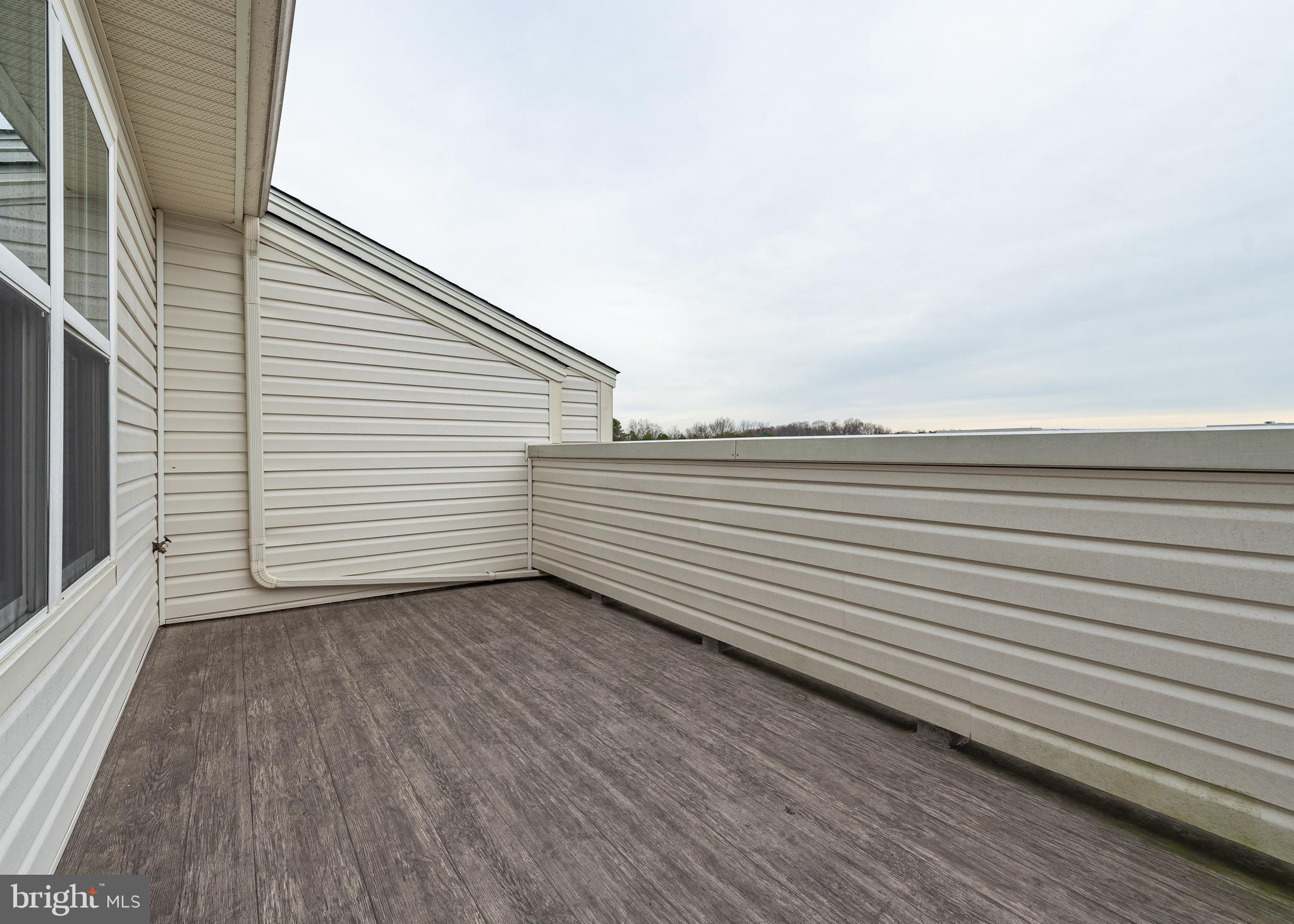 7038 Rackham Way Hanover, MD 21076 - Photo 20 of 30 a view of a terrace with wooden floor
