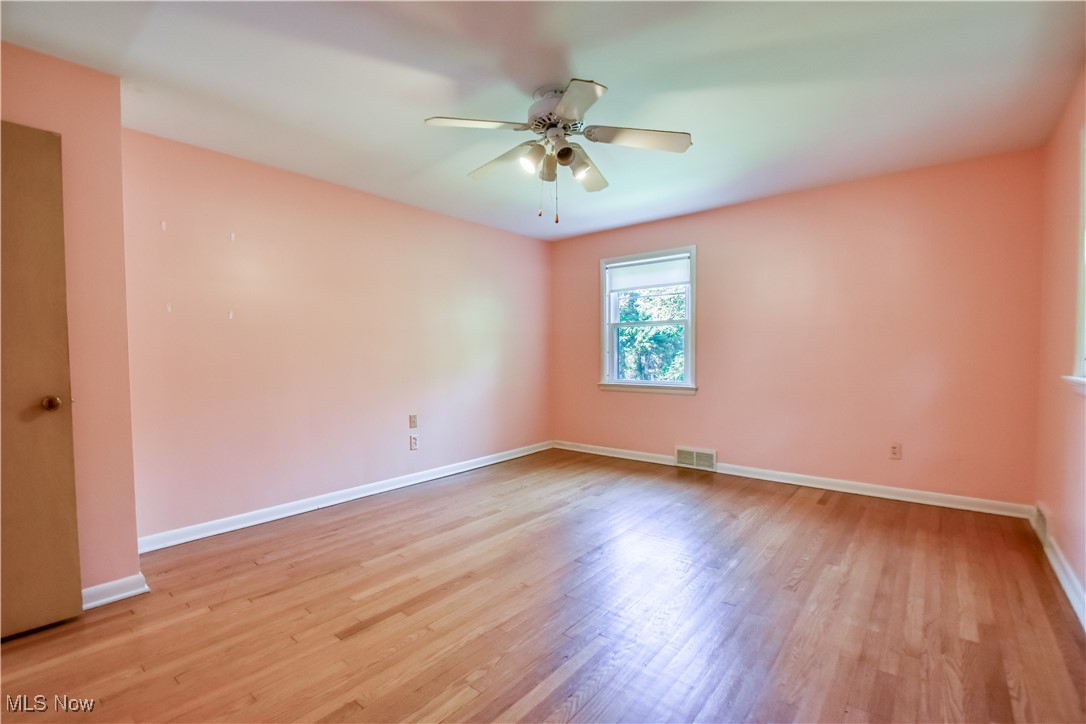 2607 Ashurst Road University Heights, OH 44118 - Photo 27 of 39 Unfurnished room with ceiling fan and light wood finished floors