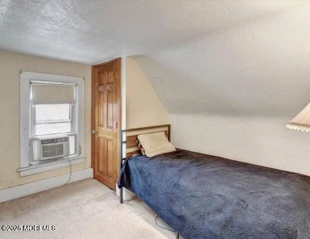a bedroom with furniture and a baby crib
