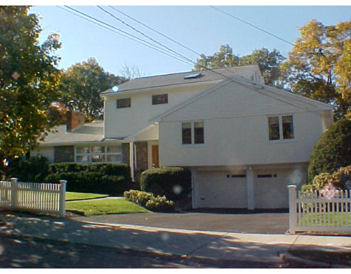 293 Hartman Road Newton, MA 02459 - Photo 1 of 8 a view of a house with a yard