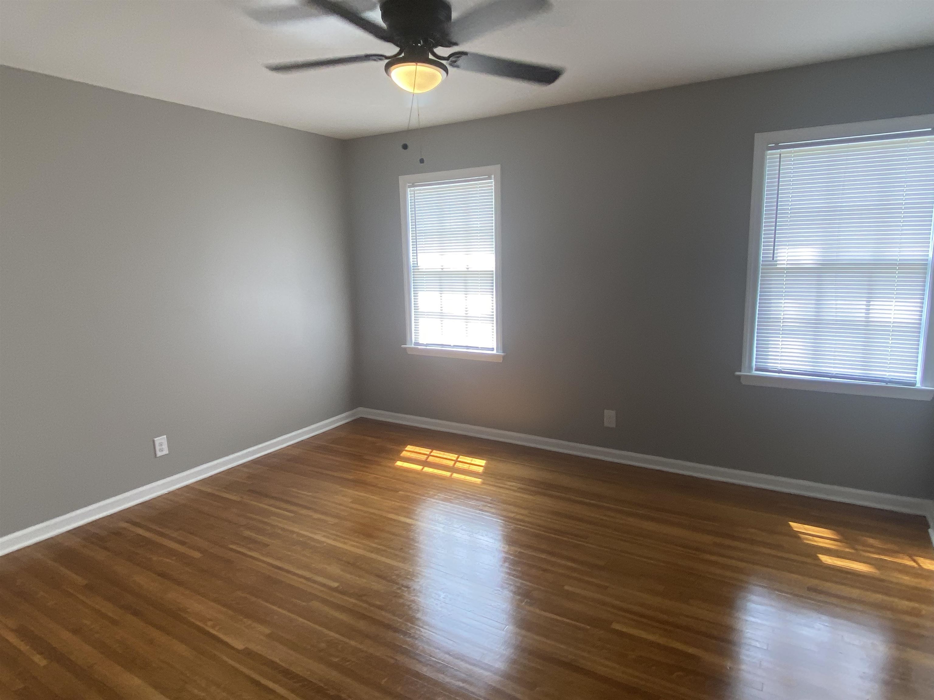 1578 Rabb Road Memphis, TN 38119 - Photo 16 of 23 a view of empty room with wooden floor and fan