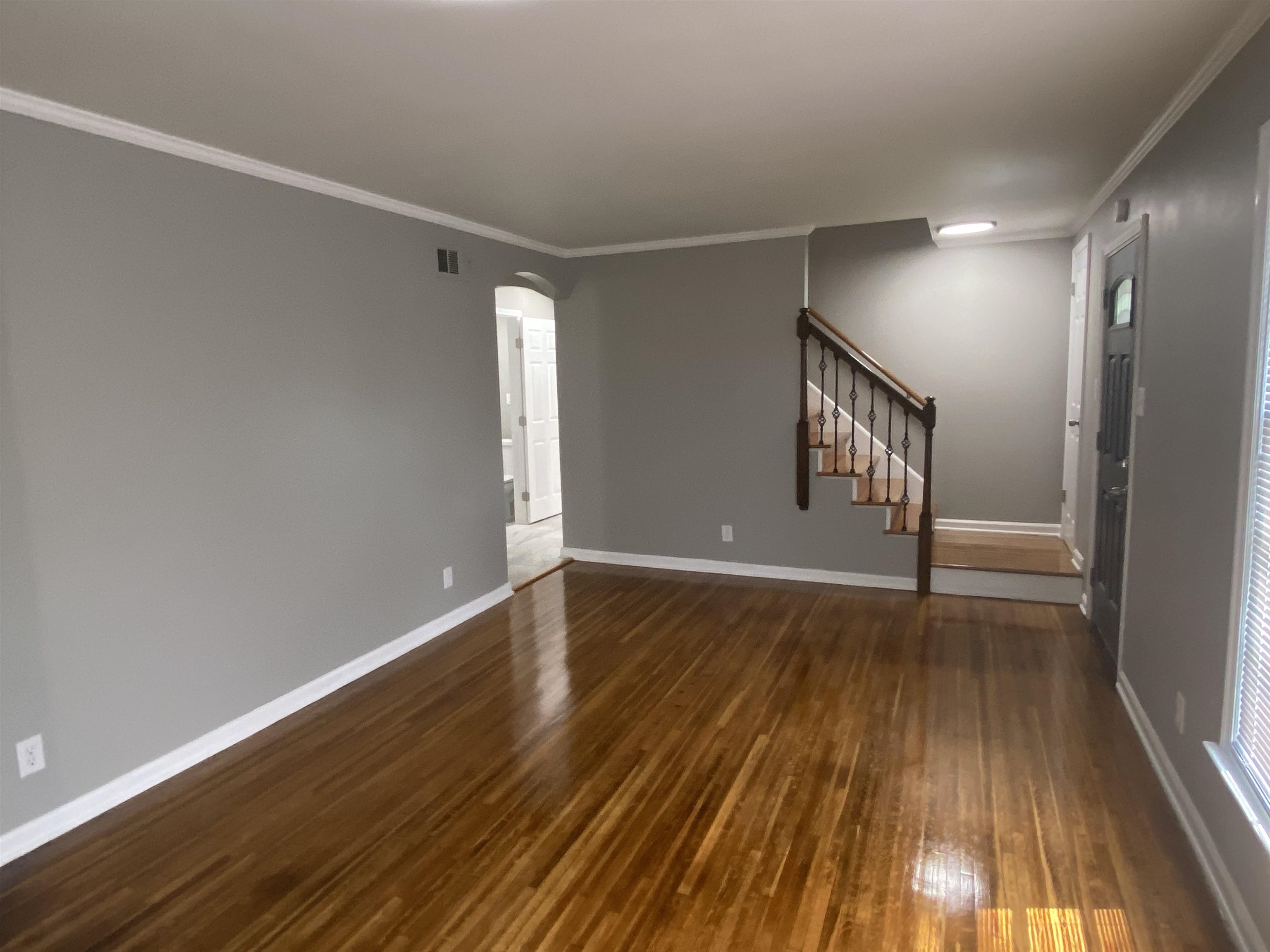 1578 Rabb Road Memphis, TN 38119 - Photo 5 of 23 a view of empty room with wooden floor and fan