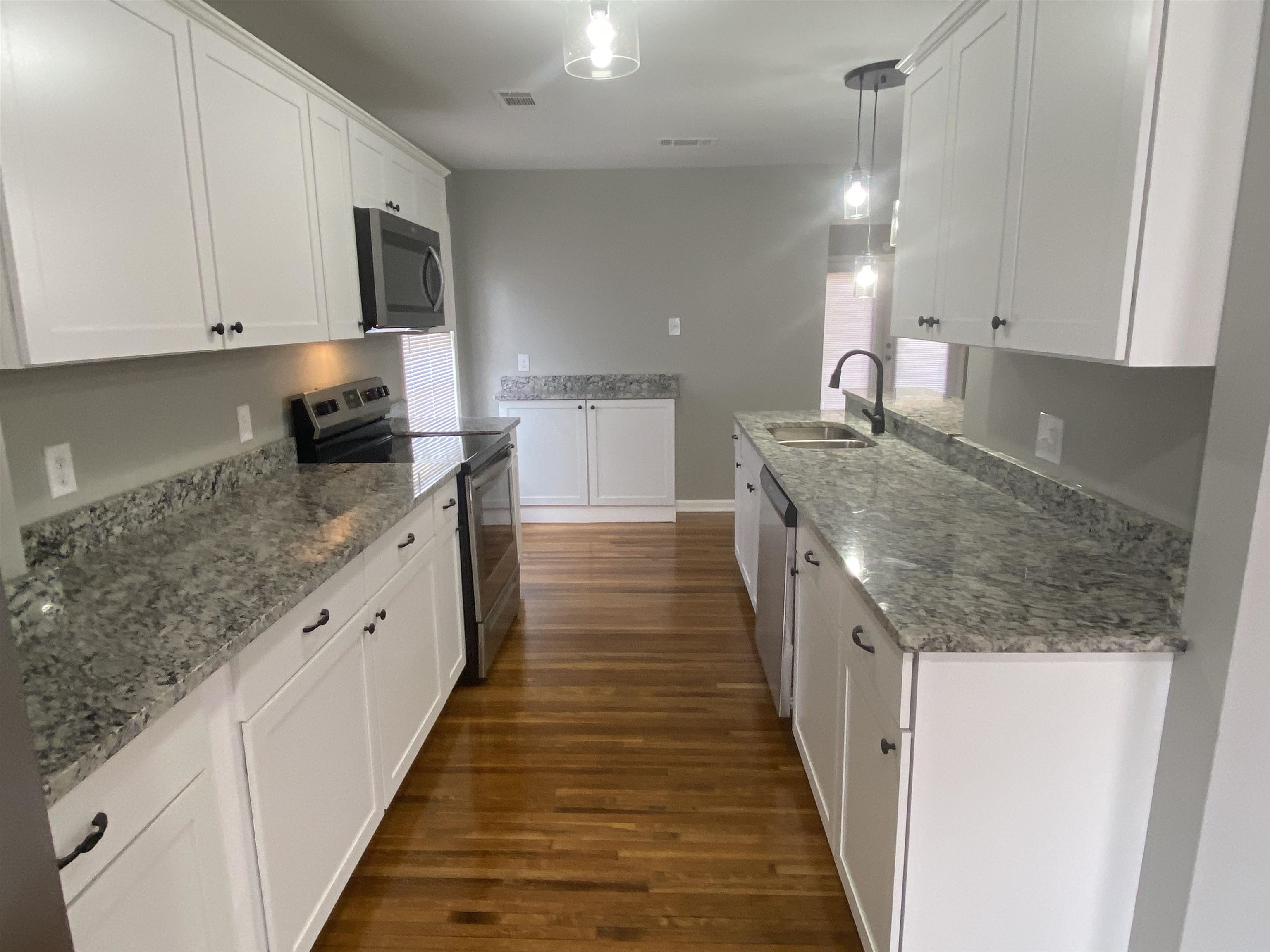 1578 Rabb Road Memphis, TN 38119 - Photo 8 of 23 a large kitchen with stainless steel appliances granite countertop a lot of counter space