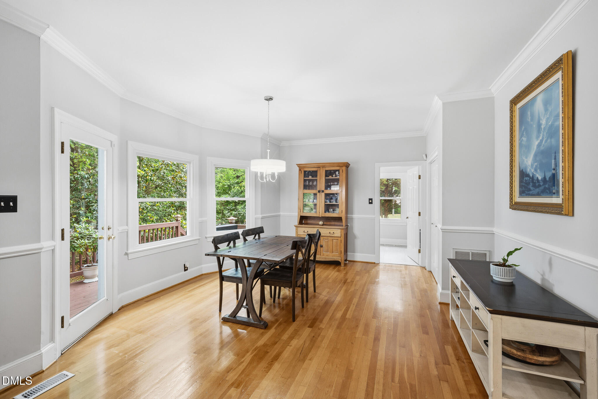 3735 Stoneybrook Drive Durham, NC 27705 - Photo 13 of 44 a view of a dining room with furniture window and wooden floor