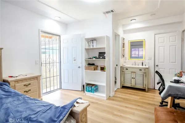 a living room with furniture a fireplace and next to a window