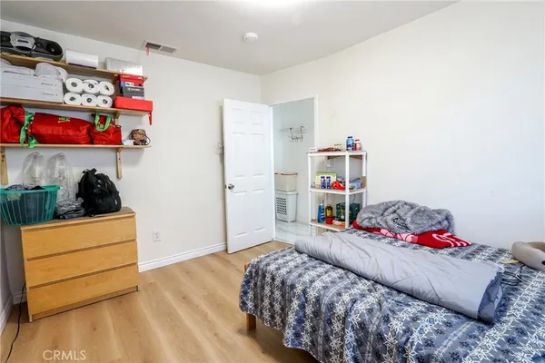 a bedroom with a bed and closet