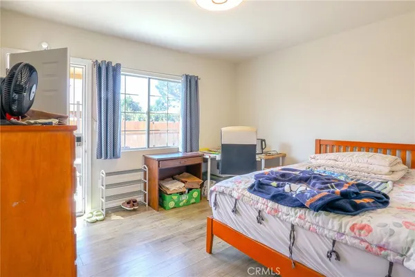 a bedroom with a bed and a table in it