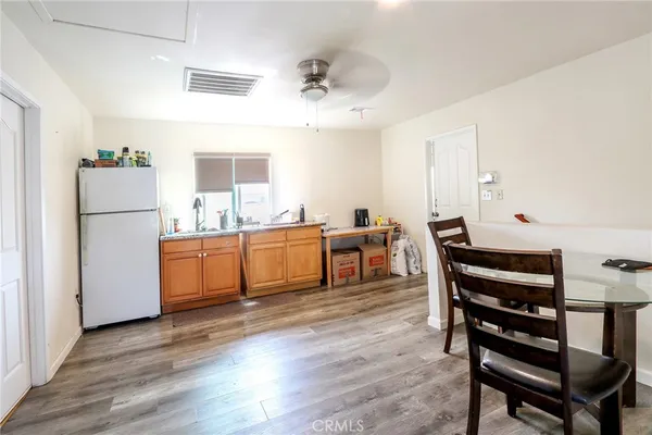 a view of kitchen with cabinets and wooden floor