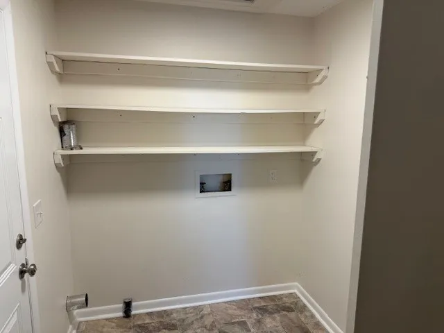 a view of a room with racks on the wall