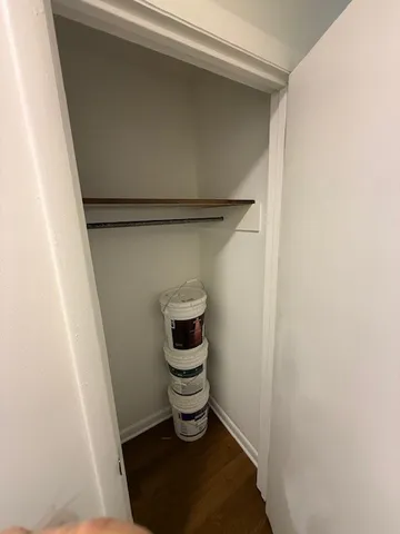 a bathroom with a toilet and a window