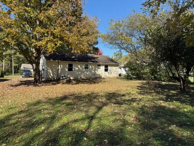 a view of patio with a yard