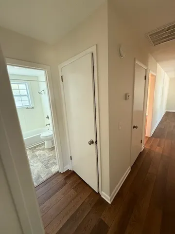 a view of front door with wooden floor