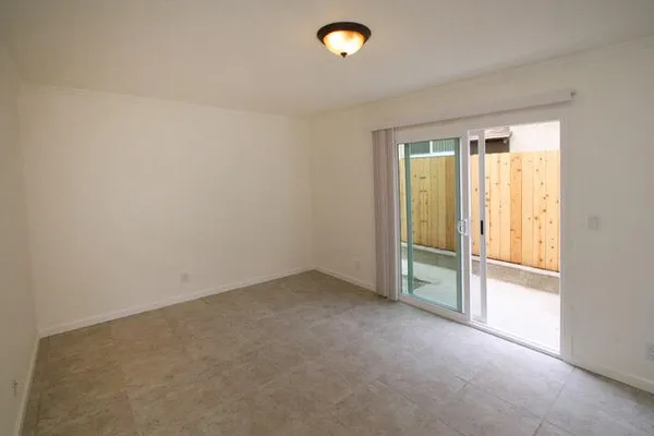 an empty room with a empty space and a window