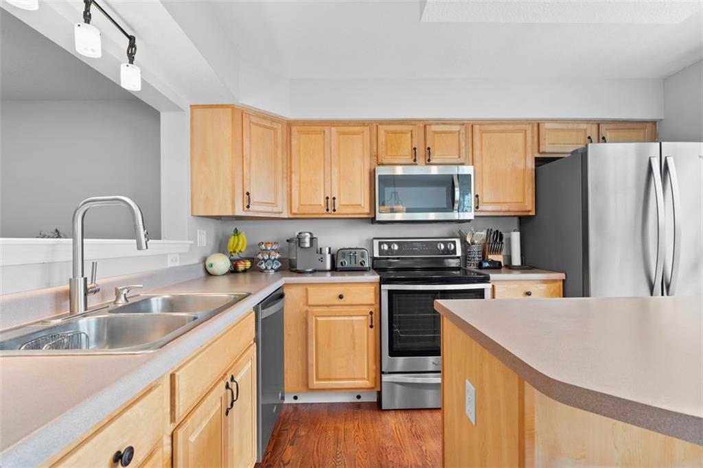 23 Castle View Drive McKees Rocks, PA 15136 - Photo 12 of 27 a kitchen with stainless steel appliances granite countertop a sink stove and refrigerator