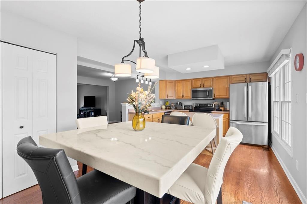 23 Castle View Drive McKees Rocks, PA 15136 - Photo 14 of 27 a view of a dining room and livingroom with furniture wooden floor a chandelier
