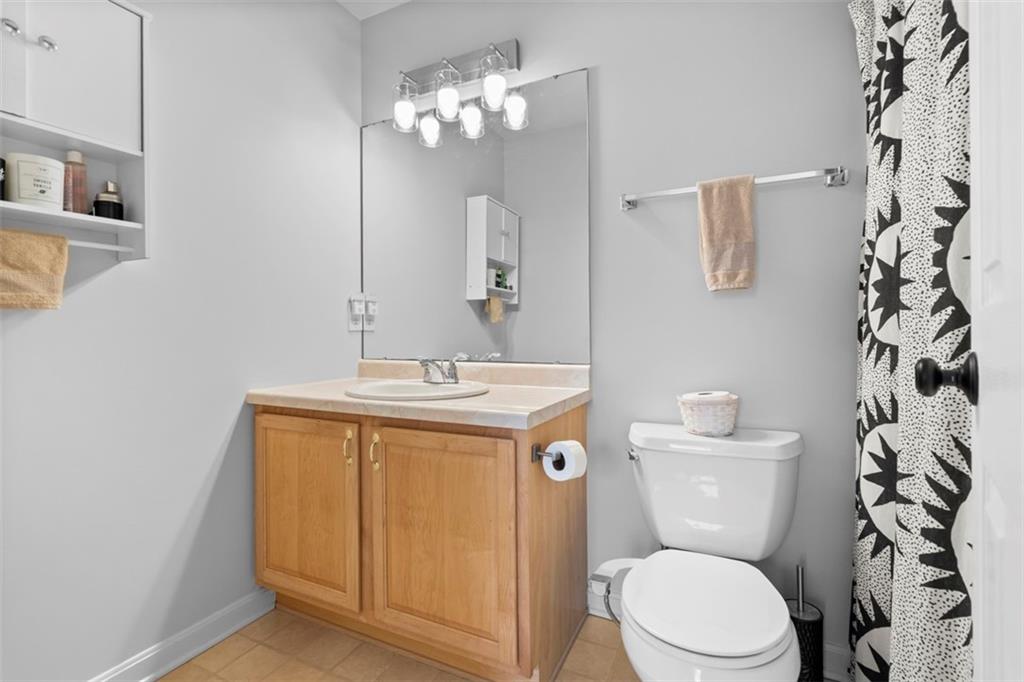 23 Castle View Drive McKees Rocks, PA 15136 - Photo 18 of 27 a bathroom with a toilet sink and mirror
