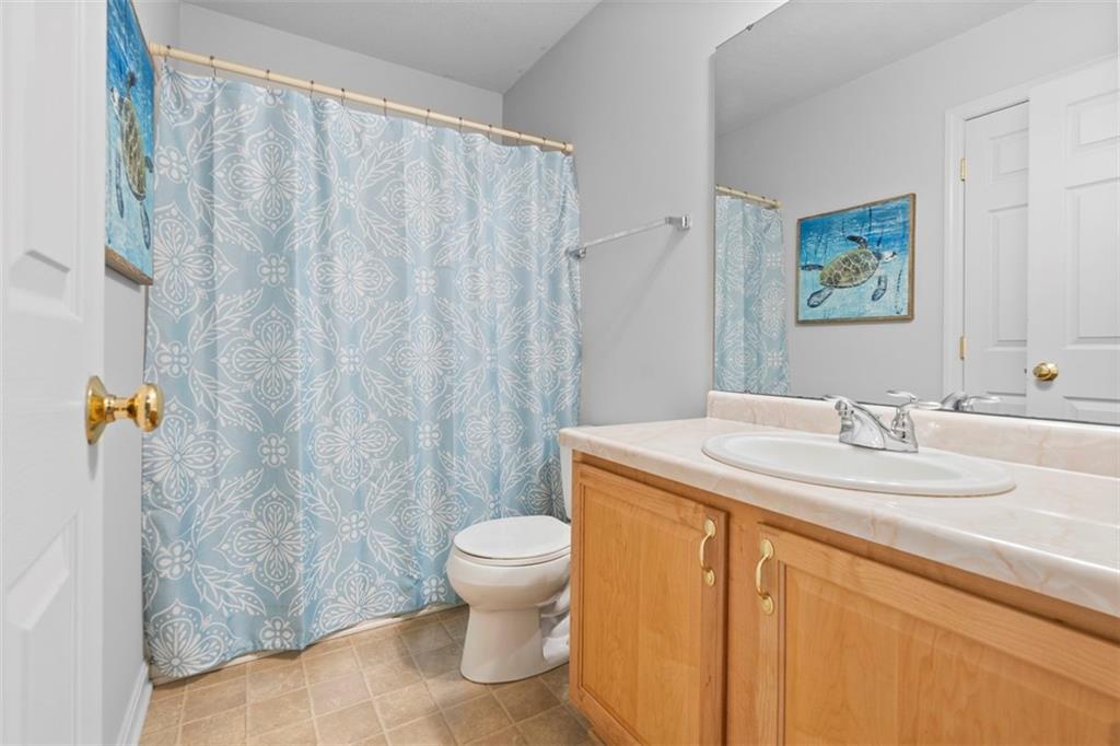 23 Castle View Drive McKees Rocks, PA 15136 - Photo 21 of 27 a bathroom with a granite countertop sink a toilet and a shower
