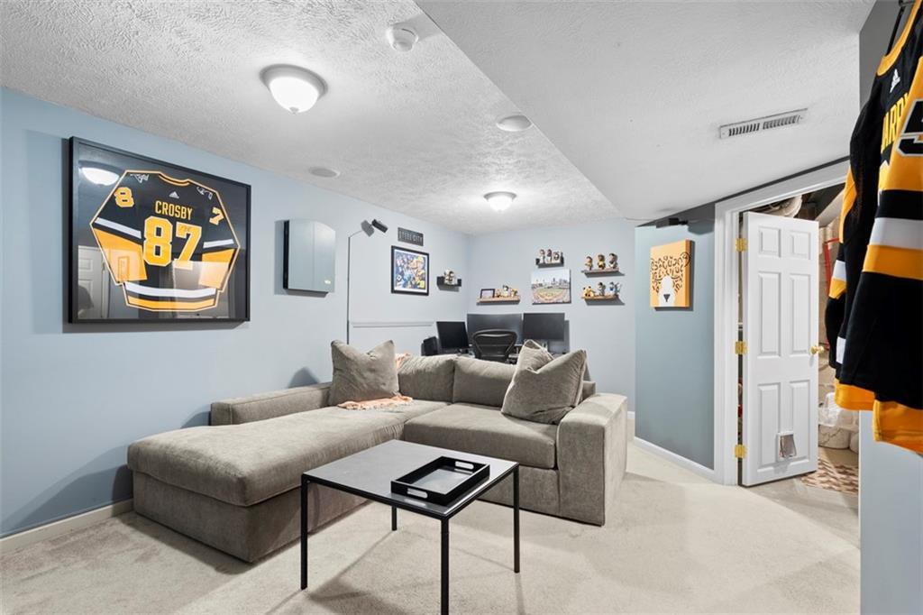 23 Castle View Drive McKees Rocks, PA 15136 - Photo 22 of 27 a living room with furniture and a flat screen tv