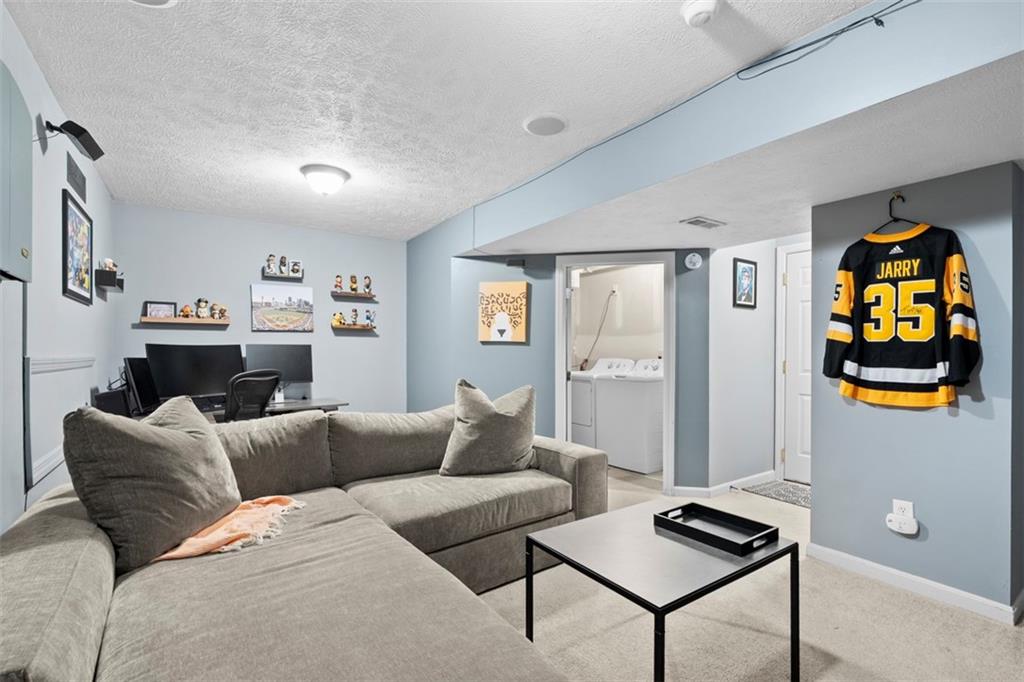23 Castle View Drive McKees Rocks, PA 15136 - Photo 23 of 27 a living room with furniture and wooden floor