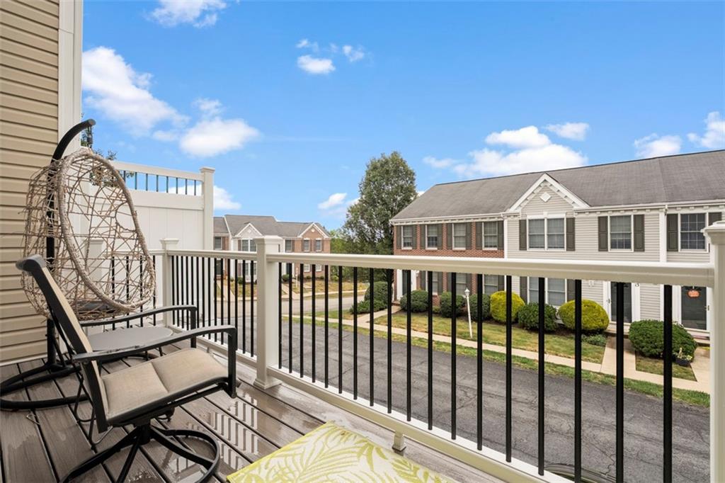 23 Castle View Drive McKees Rocks, PA 15136 - Photo 26 of 27 a view of a balcony with two chairs and a potted plant