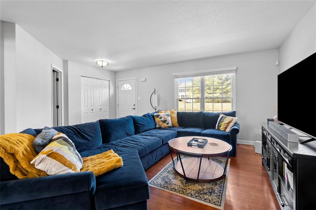 23 Castle View Drive McKees Rocks, PA 15136 - Photo 6 of 27 a living room with furniture a flat screen tv and a window