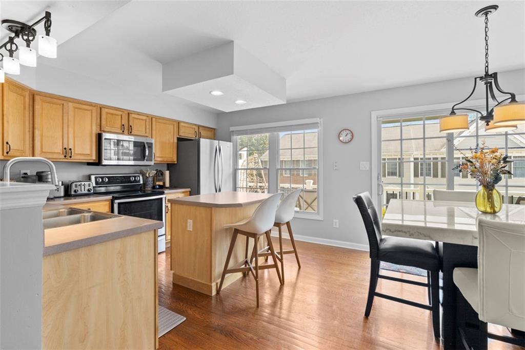 23 Castle View Drive McKees Rocks, PA 15136 - Photo 10 of 27 a view of a dining room with furniture window and wooden floor