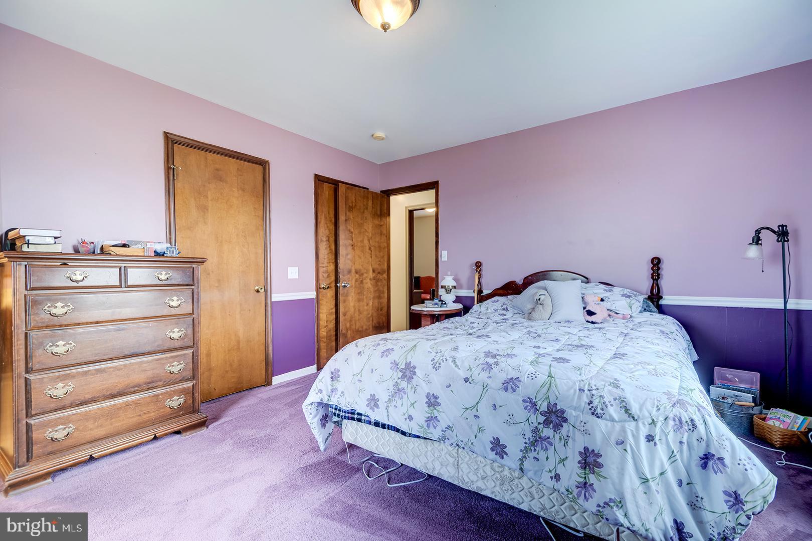 10046 Woodyard Road Greenwood, DE 19950 - Photo 22 of 45 a bedroom with a bed and a dresser