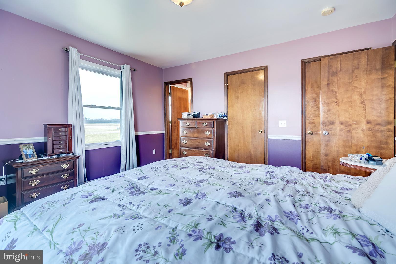 10046 Woodyard Road Greenwood, DE 19950 - Photo 24 of 45 a bedroom with a bed and a dresser