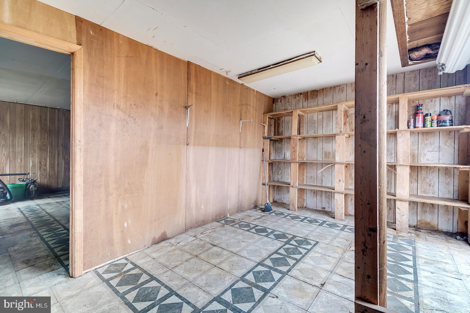 10046 Woodyard Road Greenwood, DE 19950 - Photo 30 of 45 a bedroom with a bed and a book shelf