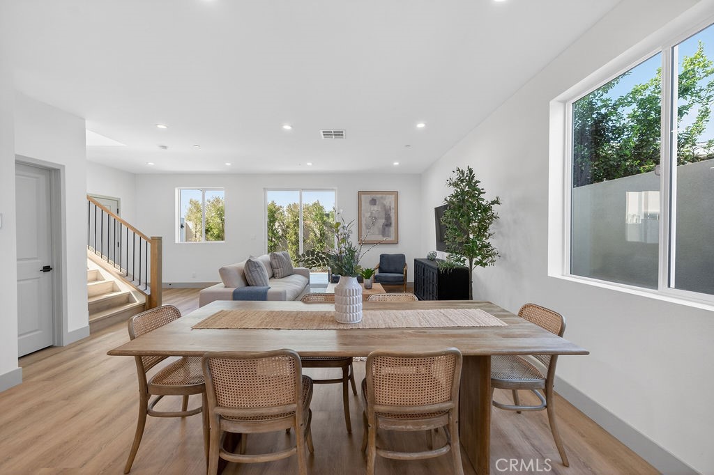 15540 Colorado Avenue Paramount, CA 90723 - Photo 19 of 63 a view of a dining room with furniture window and wooden floor