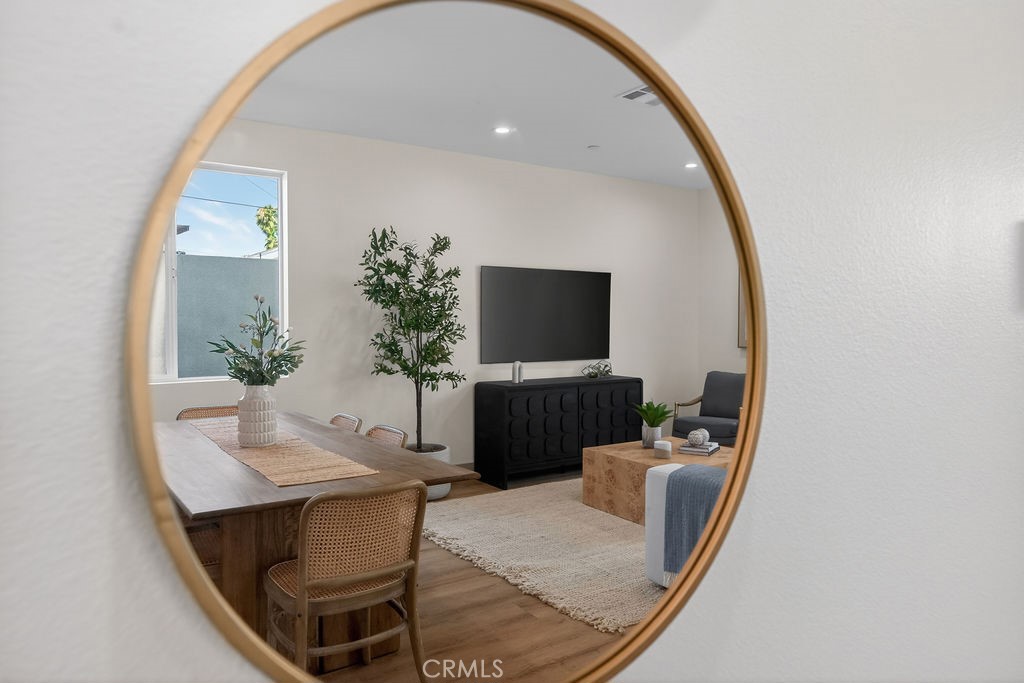 15540 Colorado Avenue Paramount, CA 90723 - Photo 21 of 63 a living room with furniture and a flat screen tv