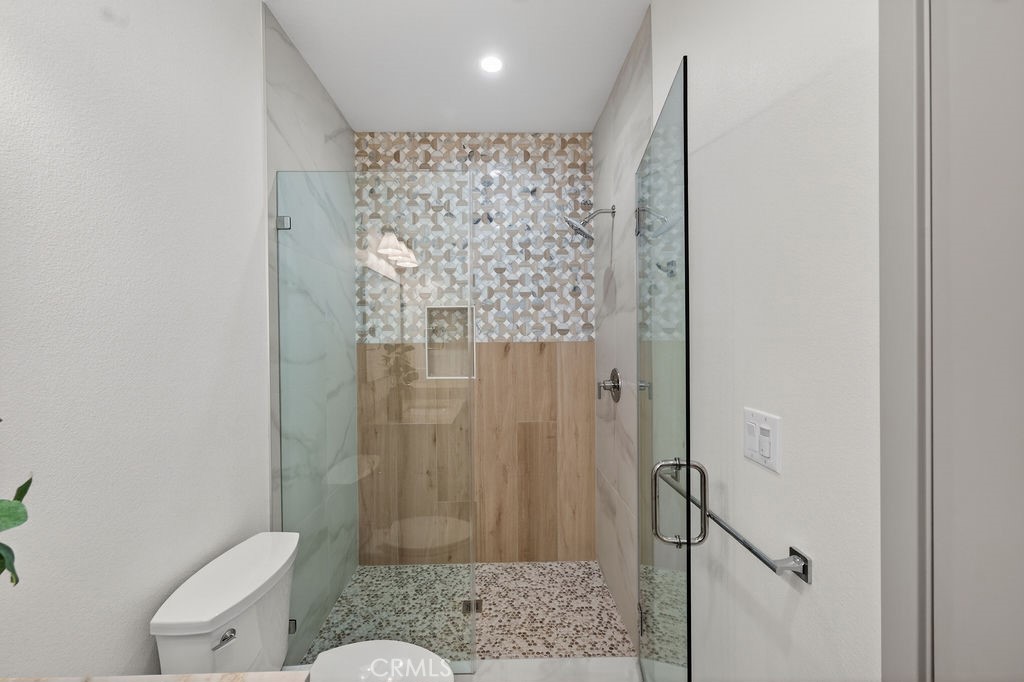15540 Colorado Avenue Paramount, CA 90723 - Photo 24 of 63 a bathroom with a shower and a toilet