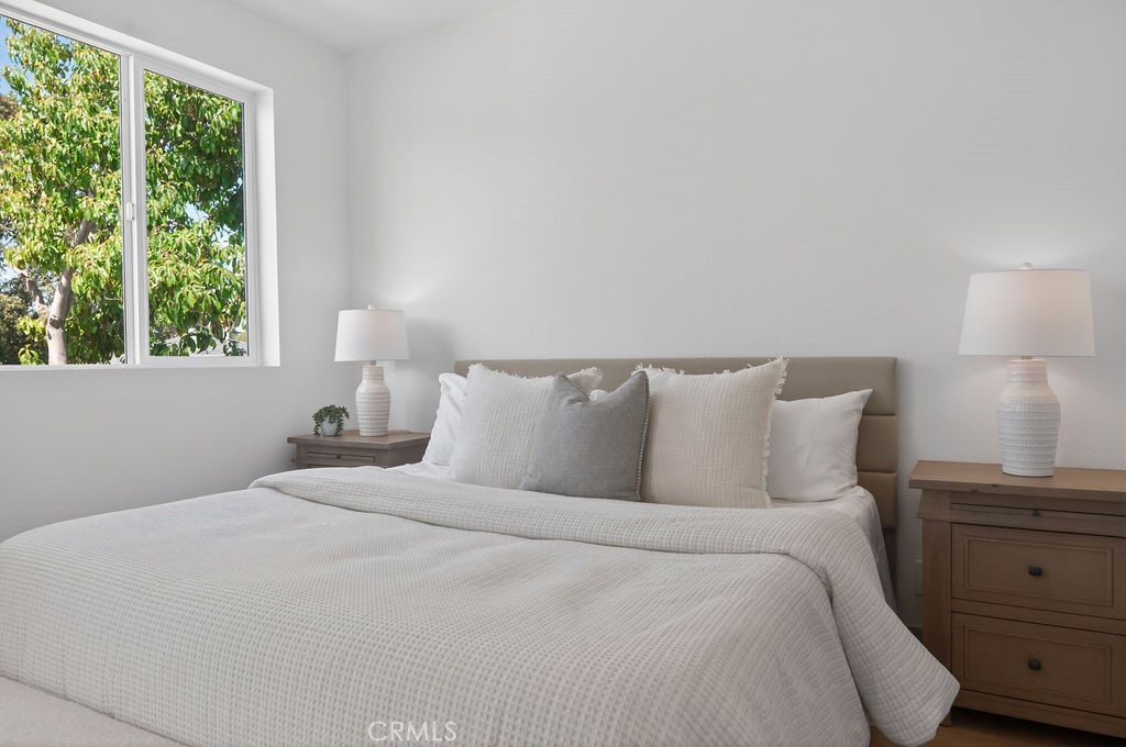 15540 Colorado Avenue Paramount, CA 90723 - Photo 29 of 63 a bedroom with a bed and a window