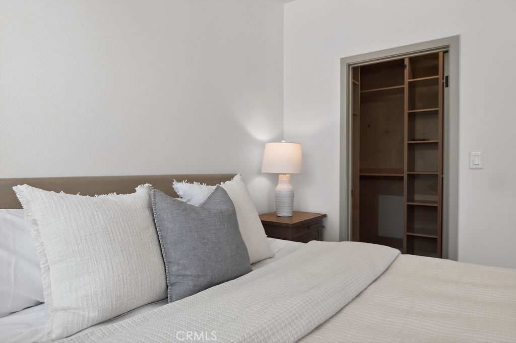 15540 Colorado Avenue Paramount, CA 90723 - Photo 32 of 63 a bed room with a bed and a lamp