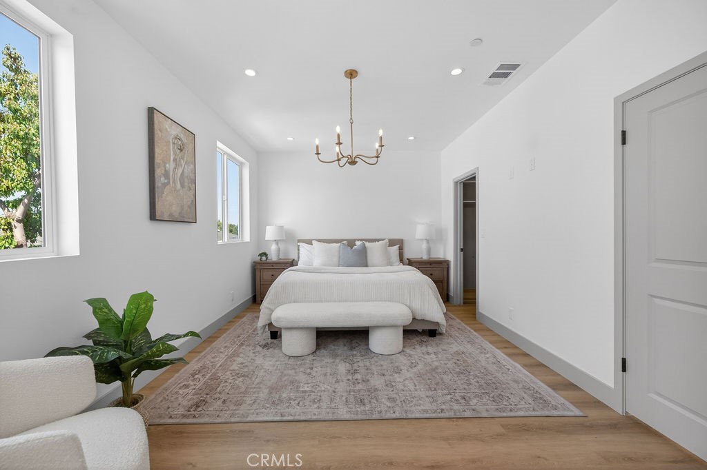 15540 Colorado Avenue Paramount, CA 90723 - Photo 33 of 63 a living room with furniture and a chandelier