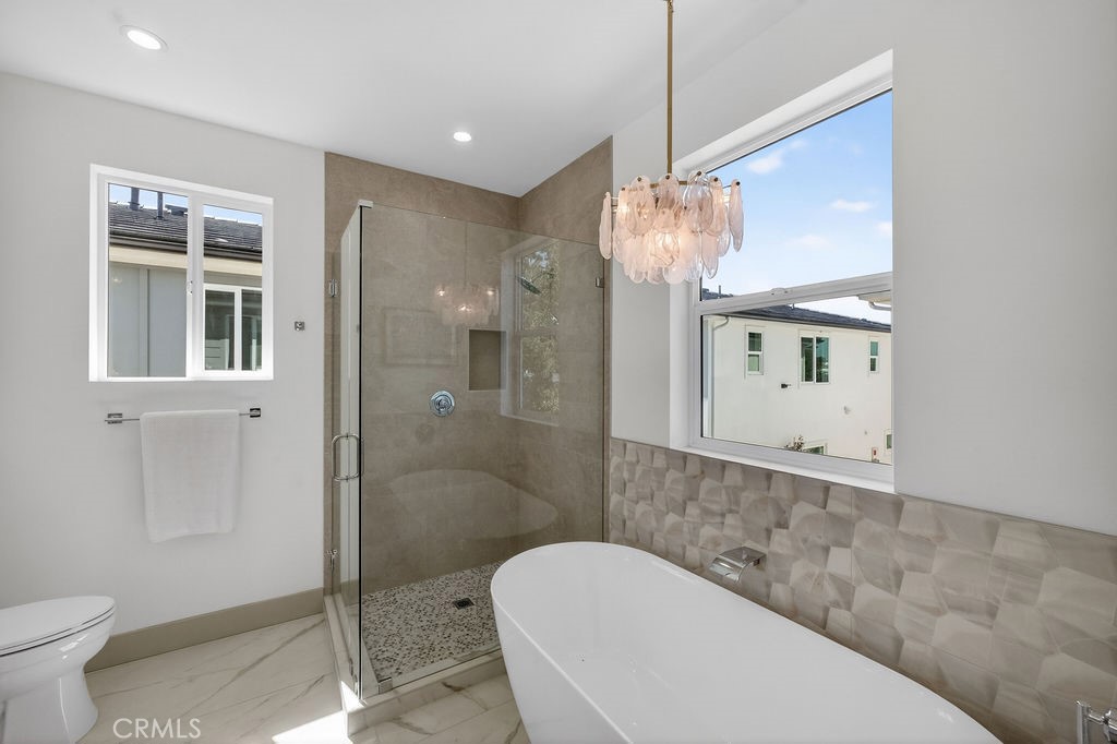 15540 Colorado Avenue Paramount, CA 90723 - Photo 36 of 63 a bathroom with a toilet a sink and shower