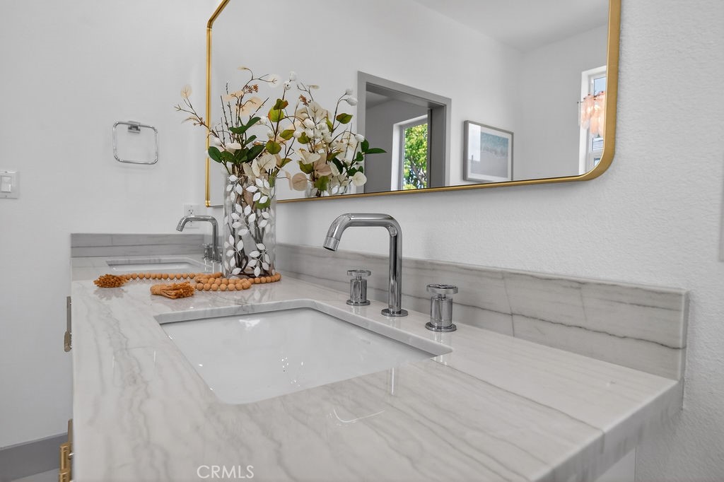 15540 Colorado Avenue Paramount, CA 90723 - Photo 37 of 63 a bathroom with a sink and a mirror