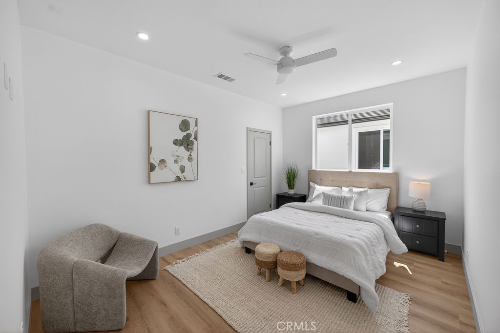 15540 Colorado Avenue Paramount, CA 90723 - Photo 41 of 63 a bedroom with a bed and a couch