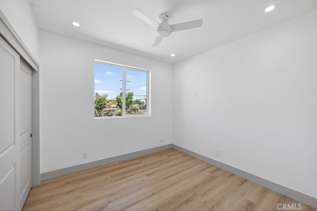 15540 Colorado Avenue Paramount, CA 90723 - Photo 43 of 63 an empty room with a window and a ceiling fan