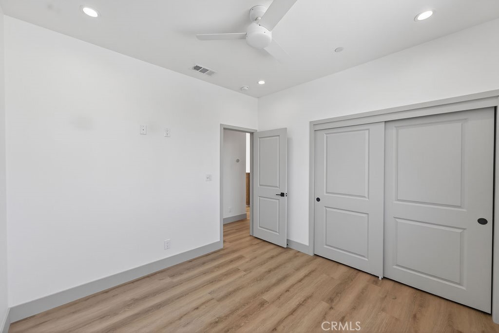 15540 Colorado Avenue Paramount, CA 90723 - Photo 44 of 63 a view of an empty room with wooden floor