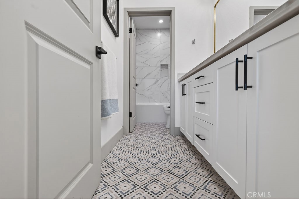 15540 Colorado Avenue Paramount, CA 90723 - Photo 45 of 63 a bathroom with a shower and a door