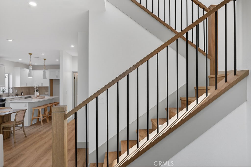 15540 Colorado Avenue Paramount, CA 90723 - Photo 5 of 63 a view of a hallway with wooden floor and staircase